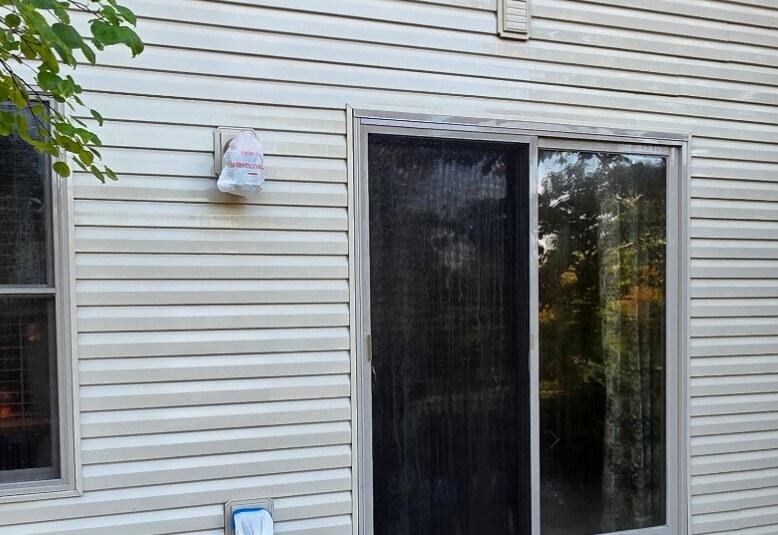 Vinyl siding and patio door soft washed clean — after